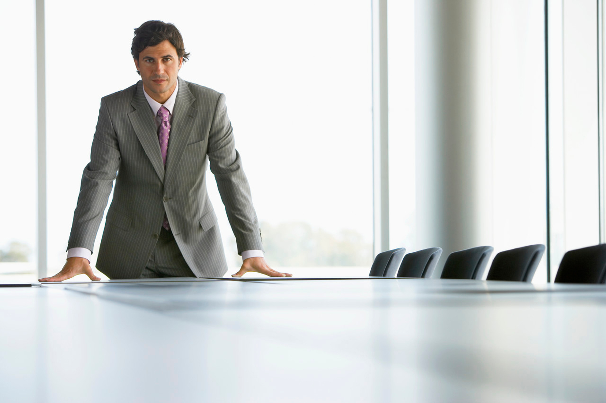 Businessman in Conference Room --- Image by © Royalty-Free/Corbis